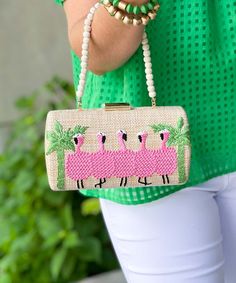 Introducing our "Be A Flamingo Clutch Bag," a delightful accessory that adds a touch of whimsy and elegance to any ensemble. This charming box clutch features a faux straw exterior embellished with an embroidered flamingo motif, perfect for adding a playful pop of color and personality to your look.
Measuring at a width of 8 inches, a height of 4.25 inches, and a depth of 2 inches, this clutch offers enough room to carry your essentials while still remaining compact and stylish. The detachable shoulder chain provides versatility, allowing you to wear it as a shoulder bag or carry it as a clutch, depending on your preference.
Whether you're attending a summer wedding, heading to a tropical vacation, or simply looking to add a touch of fun to your everyday outfits, this clutch is sure to tur Summer Beige Clutch For Party, Summer Party Beige Clutch, Spring Rectangular Clutch, Rectangular Clutch For Spring, Rectangular Summer Clutch For Gift, Summer Gift Clutch Rectangular Shape, Summer Gift Rectangular Clutch, Chic Summer Clutch For Fashion, Pink Summer Beach Clutch