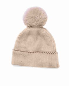 a beige hat with a pom - pom on top