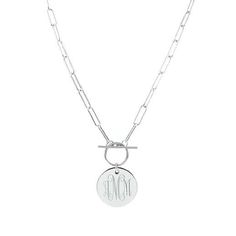 Instantly add some personality and sparkle to your outfit with our Monogrammed Pendant Disc Necklace, available in either silver- or gold-toned finishes. This personalized necklace features an attractive toggle clasp that is easy to put on and to take off. It has a cable chain with a textured chain surface that is unique and stunning. It also features a Marleylilly “ML” logo charm disc on the back. This monogrammed toggle necklace features an elegant 20mm disc that is engraved with your choice o Personalized Silver Toggle Necklace Gift, Classic Silver Toggle Necklace For Gift, Classic Silver Toggle Necklace As A Gift, Trendy Silver Monogram Jewelry, Trendy Toggle Necklace With Lobster Clasp As Gift, Trendy Silver Monogram Necklace, Engraved Round Toggle Necklace Gift, Silver Charm Necklace With Toggle Clasp As Gift, Gift Toggle Necklace With Paperclip Chain