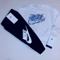 New Never Worn With Tags. Nike Set Includes A White Long Sleeve Cotton Blend Printed Sweater With Blue And Black Trim And White With "Just Do It" Inscription And Check Logo On Front And Left Sleeve. Bottoms Are Black With White Trim With Elastic Waistline And Nike Check Logo And Inscription On Left Leg. Set Fits 2 Toddler Boys. Any Questions, Please Contact Me. Thanks! Nike White Casual Sets, White Nike Casual Sets, Casual White Nike Sets, Nike Casual White Sets, Nike Casual Crew Neck Sets, Nike Crew Neck Sets With Graphic Print, Sporty White Graphic Print Sets, Nike Sets With Graphic Print And Crew Neck, Nike White Long Sleeve Set