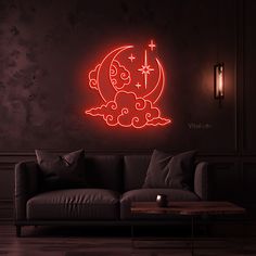 a couch sitting in front of a wall with a neon sign on it's side