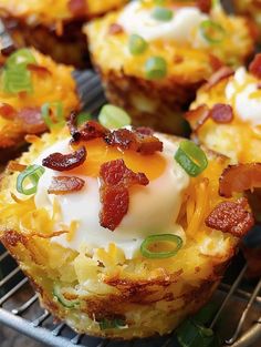 breakfast muffins with bacon, eggs and cheese on a cooling rack for consumption