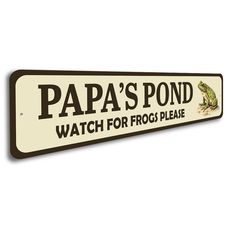 a sign that says papa's pond watch for frog please on the side of it