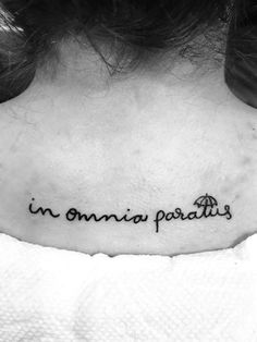 a woman's neck with the words in omnia paradis written on it