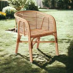 a wicker chair sitting in the grass