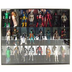 a collection of action figures on display in a glass case