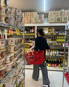 a woman is shopping in a grocery store