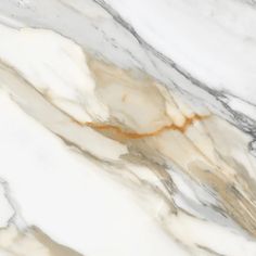 the marble is white and brown with gold streaks on it's edges, as well as an orange stripe