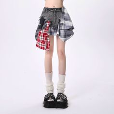 The Rayohopp Edgy Grunge Outfit Set is a women's ensemble featuring an asymmetrical patchwork skirt and a cropped 'Angster Club' graphic tee. This set combines a rebellious, grunge-inspired aesthetic with contemporary fashion elements. The skirt showcases a unique patchwork design, while the cropped tee adds an edgy statement with its bold graphic. Model's measurements: Height 160cm, Weight 45kg, Wearing size S Casual Patchwork Skirt With Asymmetrical Hem, Casual Skirt With Patchwork And Asymmetrical Hem, Casual Skirt With Asymmetrical Hem And Patchwork, Punk Asymmetrical Skirt For Summer, Punk Style Asymmetrical Skirt For Summer, Cotton Patchwork Asymmetrical Skirt, Casual Asymmetrical Skirt With Patchwork, Edgy Fitted Patchwork Bottoms, Trendy Mini Skirt With Patchwork