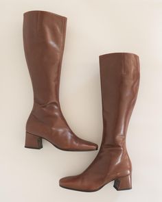 Mahogany brown knee high boots c. 1990s DKNY. Square toe. 2 inch stacked heel. Inner zipper. composition: 100% leather label: DKNY (early bold label) made in Italy condition: excellent - a few minor scuffs, sole has almost no wear tag size: 6 MEASUREMENTS length (inner sole) - 9" length (outer sole) - 9.5" width (outer sole) - 3.125" shaft - 16" heel - 2" all sales final - please review our shop policies prior to purchase Brown Knee High Boots, Mahogany Brown, Equestrian Boots, Equestrian Riding, Tall Leather Boots, Leather Label, 90s 00s, Stacked Heel, Shop Policies