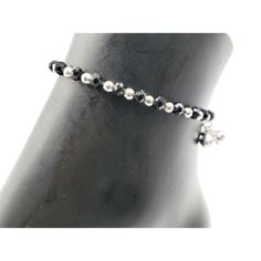 "Description 925 Sterling Silver Stretchable Black Bead Anklet (92.5% Silver purity) available in four lengths from from 4.5 inch (0-12 month) ,5.5 inch (1-3 Years) 6.5 inch (4-9 Years) & 7.5 inch (10-12 Years)and suitable for daily use. Makes low bell / charms sound \"chann-chann-chann\", weaved with NYLON Flexible elastic WIRES and stretchable . SOLD IN PAIRS. Dimensions Anklet Weight: ~8.0-12.0 grams / pair. 1 Pair 4.5-inch + 0.5 inch (nylon stretchable Extension) Anklet: ~8.0-9.0 grams ( Adjustable Black Anklet With Tiny Beads, Black Beaded Bracelets With Silver Beads For Party, Handmade Adjustable Black Anklet, Adjustable Silver Beads Anklet For Party, Black Anklets With Round Beads For Gift, Elegant Black Beaded Anklets, Bead Anklet, Bell Sound, Beautiful Anklet