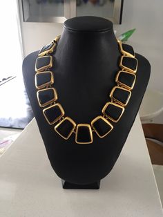 "Beautiful Anne Klein statement necklace. Modernist design in a shiny gold tone and black enamel featuring a toggle closure. CONDITION In excellent vintage condition. No wear, marks or damage. Closures are all secure The necklace measures approximately 17 3/4 inches and 1 1/8\" wide. The necklace is signed with © Anne Klein on one side of the tag and the lion's head on the underside. The necklace is also signed ©AK on a cartouche on one link. It is in excellent vintage condition Please see this Vintage Black Metal Chain Necklace, Modern Gold Necklace With Black Enamel, Retro Black Metal Necklace, Black Luxury Metal Chain Necklace, Luxury Black Metal Chain Necklace, Gold Jewelry With Black Enamel For Party, Gold Necklace With Black Enamel For Formal Occasions, Vintage Black Enamel Necklaces For Evening, Vintage Black Enamel Necklace For Evening