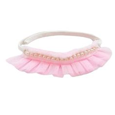 a pink headband with pearls on it