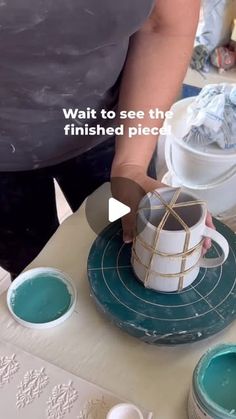 a person is pouring blue liquid into a cup