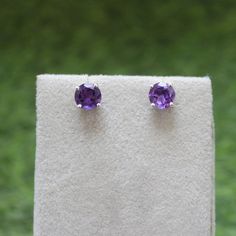 * Material: 925 Sterling Silver * DETAILS ✥ Handmade Studs ✥ - Center Stone: Natural Amethyst  - Center Stone Size: 7 MM - Center Stone Shape: Round  ✥ O T H E R ∙ I N F O R M A T I ON ✥ ♦ Your item will be nicely packed to gift in elegant jewelry boxes. ♦ Custom Order We can make custom rings in almost any shape and style. If you want a specific model, please send us a clear picture and we will do our best. ♦ Delivery All Item will be Shipped within 3 to 5 Days after payment receive. The delive Classic Gemstone Bridal Earrings As Gift, Sterling Silver Bridal Earrings Gift, Classic Bridal Earrings With Gemstone, Sterling Silver Round Cut Birthstone Earrings, Round Sterling Silver Bridal Earrings As A Gift, Purple Anniversary Earrings, Classic Purple Sterling Silver Earrings, Classic Sterling Silver Purple Earrings, Purple Prong Set Earrings For Wedding