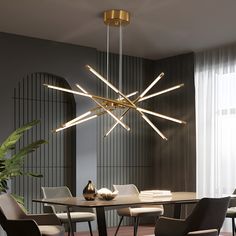 a dining room table with chairs and a large chandelier hanging from the ceiling