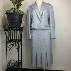 Knit blue and white blazer and skirt suit set. I believe it is a wool blend. No brand or tags. Both are fully lined. Blazer: Single button Faux pocket Cropped Notched collar Measurements (flat): Shoulder to shoulder: 16.5" Armpit to armpit: 19" Waist: 16" Bottom hem: 18" Length: 18" Sleeve: 22" Skirt: Pencil Pleated Pockets Measurements (flat): Waist: 12.5" Hips: 17" Bottom hem: 23.5" Length: 27" Approximately a size XS, please see measurements. Good condition. Fitted Skirt Suit With Pockets For Office, Spring Formal Skirt Suit With Pockets, Fitted Skirt Suit With Pockets For Spring, Classic Fitted Skirt Suit With Pockets, Vintage Blue Skirt Suit For Formal Occasions, Classic Spring Skirt Suit With Pockets, Fitted Skirt Suit For Semi-formal Spring Occasions, Fitted Skirt Suit For Semi-formal Spring Events, Retro Fitted Formal Sets