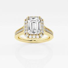 an emerald cut diamond ring with diamonds around it and two rows of pave stones on the band