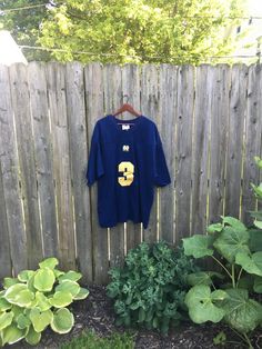 This is a great shirt for anyone that loves Notre Dame and is ready for football season. It is perfect for rocking on campus or just your daily life. It is in great condition and has no rips, holes, stains or smells. Measurements: Pit to pit: 26 1/2 inches Collar to bottom front: 26 3/4 inches Collar to bottom back: 30 1/4 inches Size on tag: XL (fits oversize) 90s Style Tops For Game Day During Sports Season, 90s Style Tops For Game Day And Sports Season, 90s Style Tops For Game Day, Football Jersey Shirt, Number 3, Athletic Fashion, Football Season, Football Jersey, White Adidas