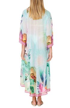 Easy and breezy, this lightweight duster is covered in a tropical floral palm and has a longline silhouette that'll look great over your favorite swimsuit on your next vacation. 53" length (size OS) Open front Short sleeves 100% polyester Hand wash cold, lay flat to dry Imported Model stats: 5'10", 32" bust, 25" waist, 36" hip. Model is wearing size OS. Multicolor Tropical Print Beach Kimono, Free-spirited Spring Beach Kimono, Pink Floral Print Kimono For Beach Cover-up, Tropical Multicolor Kimono Sleeves Cover-up, Tropical Floral Print Kimono For Beach Cover-up, Tropical Floral, Tropical Paradise, Long A Line, Front Open