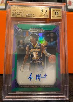 an autographed basketball card in a clear plastic case