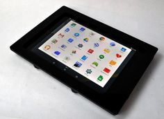 a tablet sitting on top of a white table