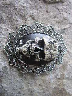 "Gorgeous brooch and pendant 2 in 1 Happy Halloween The cameo is Frankenstein's skull, each cameo is individually hand painted, each an original Wonderfully detailed The lacy setting is an antiqued silver plated or antiqued gold plated, high quality, and very unique The brooch measures about 2 1/4\", perfect size The last photo is to show the pin and the bail for the necklace, the color on the back will be black, not red. This is a wonderful piece to pass down from generation to generation Perfe Steampunk Skull Jewelry For Halloween, Halloween Brooch Jewelry Gift, Halloween Gift Jewelry Brooch, Silver Brooch Jewelry For Halloween, Gothic Brooch Jewelry Gift, Gothic Halloween Brooches For Gift, Halloween Gothic Brooch Jewelry, Gothic Halloween Brooch Jewelry, Black Gothic Brooch Jewelry