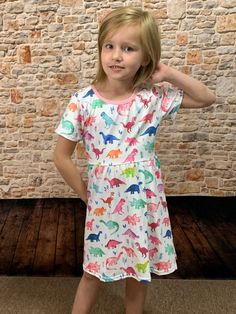 RAWR! Talk about adorable! Your dinosaur loving little girl will still be able to twirl in this super cute colorful dino dress! Features short sleeves and round neckline. She will be in love with this dress. Available size range - 6M-8 95% Cotton, 5% Spandex Imported Model is 46in wearing size 6 | 7. Fit is true to size. Baby sizes run more on the larger number. Sizing chart can help approximate the appropriate size. Size Label Height (in.) 0M | 3M 4XS 20 - 23 3M | 6M 3XS 22 - 26 6M | 12M 2XS 25 Dino Dress, Dinosaur Dress, Cute Summer Outfits, In The Wild, Baby Size, The Wild, Talk About, Round Neckline, Lily Pulitzer Dress