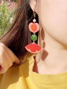 🍏Handmade creative fruit earrings, bright and colorful, perfect for summer and vacation wear! Each piece is hand drawn with colored pencils on shrink plastic film, and resin is applied on the surface. The color won't fade or change. The earring hoop is hypoallergenic 18k gold-plated brass.  🍋I have made 4 different earring designs which can create 6 different pair variations. The default is Apple+Strawberry and Peach+Kiwi. If you want a different combination, pls send me a message after you place an order.  🍊This item is designed and made in Canada. If you are ordering from outside Canada, pls leave your phone number as it is required by my carrier. Thank you! Playful Orange Dangle Jewelry, Summer Beach Dangle Hoop Earrings, Summer Vacation Dangle Hoop Earrings, Cute Summer Vacation Jewelry, Cute Drop Earrings For Summer, Multicolor Fruit Design Earrings For Gift, Summer Fruit Design Earrings, Colorful Handmade Hoop Earrings For Summer, Summer Fruit Design Drop Earrings