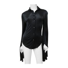 A fabulous black fine stretch silk shirt, top, blouse from Tom Ford for Gucci. It is semi fitted with a shirt collar, black mother of pearl Gucci inscribed button up the front and great long draping angel sleeves. Fit sizes Extra Small, Small. Marked Italian size 38. Bust 35" Sleeves 36" Length 26" Luxury Gucci Blouse For Office, Elegant Gucci Blouse For Evening, Elegant Gucci Blouse For Party, Gucci Formal Button-up Blouse, Gucci Black Tops For Spring, Gucci Button-up Blouse For Formal Occasions, Elegant Gucci Party Blouse, Black Gucci Winter Top, Gucci Collared Blouse For Formal Occasions