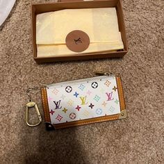 Louis Vuitton White And Rainbow Vintage Wallet/Keychain Bought Off The Real Real Luxury Multicolor Wallets For Travel, Designer Rectangular Coin Purse For Travel, Designer Wallet With Mobile Phone Bag For Everyday, Luxury White Wallet For Travel, Designer White Travel Wallet, White Designer Bag With Card Slots, Designer White Bags With Card Slots, Monogram Canvas Rectangular Wallets As Gifts, Luxury White Travel Wallet