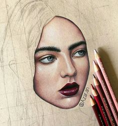 a pencil drawing of a woman's face with blue eyes and red lipstick on it