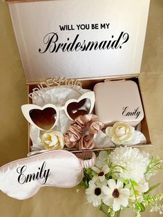 the bridesmaid box is filled with personalized items for her special day,