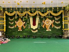 a stage decorated with flowers and decorations