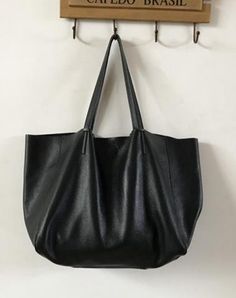 Overview: Design: Fashion Womens Silver Leather Oversize Tote Bag Black Shoulder Tote Bag Handbag Tote For WomenIn Stock: Made to order (2-3 days)Include: Tote + A detachable Side InnerCustom: NoColor: Silver, BlackLeather: CowhideMeasures: Horizontal Style S: 46cm/Bottom 34cm x 30cm x 14cmHorizontal Style L: 50cm/Bottom 37cm x 33cm x 16cm Vertical Style S: 41cm/Bottom 33cm x 35cm x 11cm Vertical Style L: 47cm/Bottom 37cm x 40cm x 11cmWeight: 0.75 kgSlots: 1 slotAccessories(option): NoStyle: Fas Oversized Tote Bag, Oversized Tote, Bags Black, Tote Bag Purse, Leather Bags Handmade, Genuine Leather Bags, Shoulder Tote Bag, Black Tote Bag, Shoulder Tote