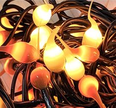 a bunch of lights that are on some kind of wire