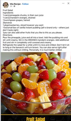 a bowl filled with fruit sitting on top of a counter next to a recipe page