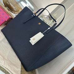 Tory Burch 134836 Emerson Navy Blue Brown With Gold Hardware Women's Large Tote Bag - Dimensions: 11" X 19" X 5" Inches Designer Navy Shopping Bag, Designer Navy Shoulder Bag For Shopping, Navy Shopping Bag With Gold-tone Hardware, Navy Shoulder Bag With Gold-tone Hardware For Shopping, Luxury Navy Tote Shoulder Bag, Elegant Navy Travel Bags, Classic Navy Shopping Bag, Classic Navy Bag With Gold-tone Hardware, Classic Navy Tote Shoulder Bag