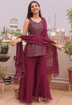 Readymade Faux Georgette Pakistani Suit in Wine. This attire with Cotton Lining is Enhanced with Resham and Sequins Work. Available with a Faux Georgette Palazzo and Faux Georgette Gota Lace Dupatta in Wine.The Kameez and Bottom Length are 32 and 40 Inches Respectively. We sell all kinds of salwar kameez sets for women Georgette Salwar Kameez | Crepe Salwar Kameez | Art Silk Salwar Kameez | Velvet Salwar Kameez | Chiffon Salwar Kameez | Net Salwar Kameez | Zari Work Salwar Suits | Indian Festiva Palazzo Salwar Suits, Embroidered Fitted Georgette Pant Set, Fitted Embroidered Georgette Pant Set, Long Suits Indian Party Wear, Fitted Purple Embroidered Palazzo Set, Purple Sleeveless Festive Sets, Elegant Purple Chinon Sets, Embellished Purple Georgette Set, Purple Embellished Georgette Sets