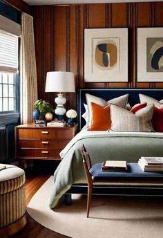 a bedroom with wood paneled walls and furniture in the corner, along with paintings on the wall