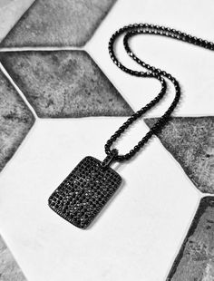 《《  FOR YOUR JOURNEY COLLECTION  》》 THE DETAILS The "BLACK PAVÉ TAG" Necklace is designed with an incredibly detailed Pavé Black Cubic Zirconia Black Stainless Steel Dog Tag Pendant, suspended from a Black Stainless Steel Box Chain available in your choice of length! 🔷️🔶️🔷️View the entire FOR YOUR JOURNEY COLLECTION here: https://www.etsy.com/shop/mrmackjewelry/?section_id=27030044 MATERIALS * 1 1/2" × 1" Pavé Black Cubic Zirconia Black Stainless Steel Dog Tag Pendant  * 3mm Black Stainless Steel Box Chain  * Black Stainless Steel Lobster Clasp  ⤵️NOTE: Our BLACK Stainless Steel Jewelry Materials are created using a process called PVD (Physical Vapor Disposition), which is a Vacuum Coating process that's 10x THICKER than Plating, making your Jewelry TARNISH RESISTANT, WATERPROOF, & SCRA Black Necklaces With Box Chain And Rectangular Pendant, Black Box Chain Necklace With Rectangular Pendant, Black Rectangular Pendant Necklace With Box Chain, Black Dog Tag Jewelry For Gifts, Necklace Length Chart, Jewelry Materials, Dog Tag Pendant, Man And Dog, Jewelry Care Instructions