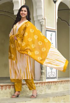 Grab this beautiful 3-piece set. The set comes with straight cut tie dye kurta has v neck, 3/4th sleeves & calf length teamed with printed trouser pants and a printed chanderi cotton dupatta to match. Color - Yellow & White Kurta Fabric-Viscose Pant Fabric-Viscose Dupatta Fabric- Chanderi Cotton Neck-V Neck Sleeves-3/4th Sleeves Work - Tie Dye & Print Detailing Washing Instructions-Dry Clean Model Height - 5.5 wearing size small. DISCLAIMER - The color of the product may be differ due to screen settings of device. A misprint here and a colour drop slip there is the beauty of printing which is not treated as a defect. Tie Dye Kurta, Kurta Pant Set, White Kurta, Cotton Dupatta, Kurta With Pants, Womens Size Chart, Tie Dye Print, Pant Set, Trouser Pants