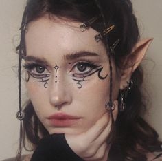 Ren Faire Face Paint, Black Fairy Makeup Looks, Goth Elf Aesthetic, Dark Fairy Makeup Tutorial, Dark Elf Tattoo, Goth Elf Makeup, Dark Fairy Makeup Looks, Dark Fairycore Makeup, Fairy Goth Makeup