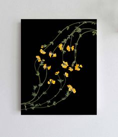 the yellow flowers are growing on the black background canvas wall art print with white frame