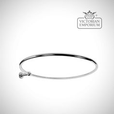 the victoria emporium bang bracelet is shown in white gold and features a small diamond