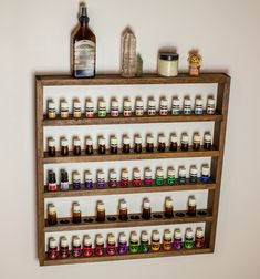 a shelf filled with lots of different types of bottles on top of eachother