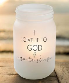 a white mason jar that says, give it to god and go to sleep