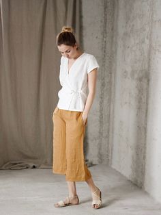 * 100% washed linen * Short sleeve * Handmade in Slovakia * Model is 176 cm height, wearing Size S, color offwhite Measurements: Size XS - cloth (laying on the floor): Bust: 42 cm Length (from the neckline to the hem measured from the back): 56 cm Length from shoulder to waist line: 36 cm ---------------------------- Size S - cloth (laying on the floor): Bust: 44 cm Length (from the neckline to the hem measured from the back): 58 cm Length from shoulder to waist line: 38 cm --------------------- Linen Top Women, Raspberry Color, Early Christmas Shopping, Linen Short, Off White Color, On The Floor, Linen Top, Linen Women, Slovakia