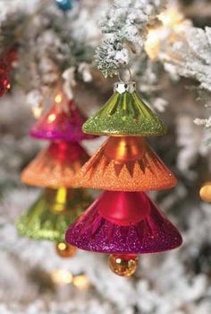 colorful ornaments hanging from a christmas tree