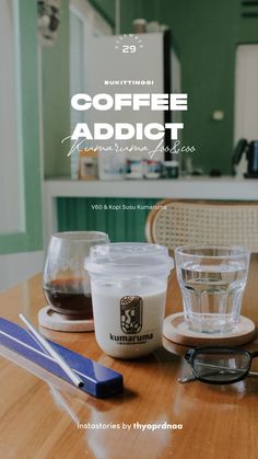 coffee and glasses sitting on top of a wooden table